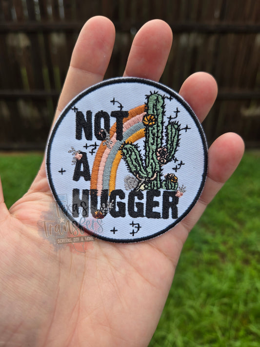 Not a Hugger Iron-On PATCH - Texas Transfers and Designs